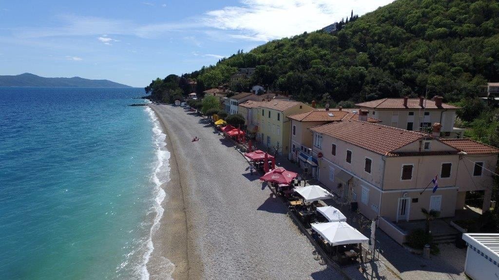 Pebble beach and seafront at Mošćenička Draga